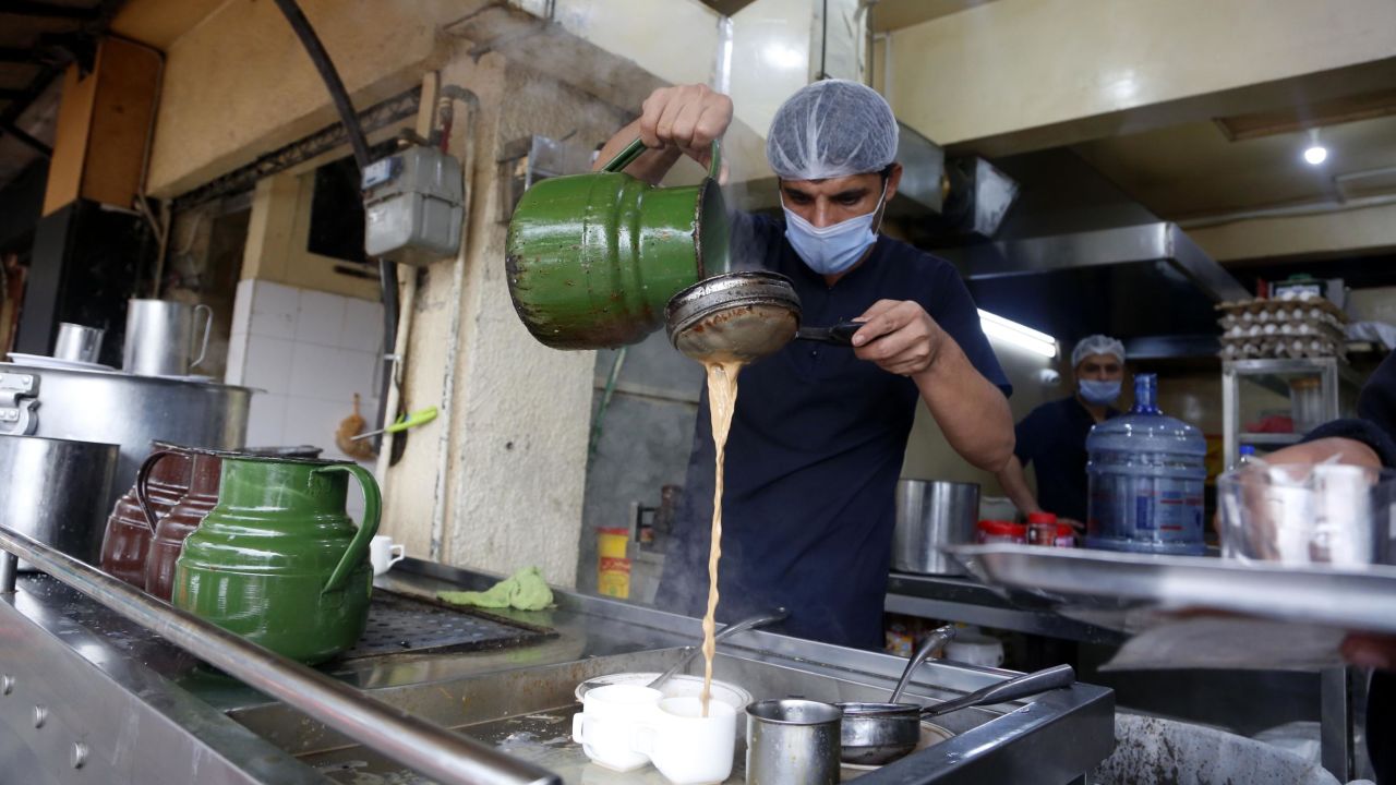 A man makes milk tea at a shop in Islamabad, the capital of Pakistan, on Feb. 23. 