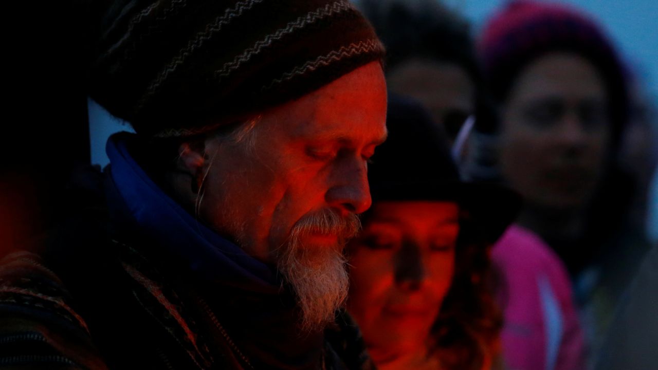 People observe the summer solstice in Glastonbury in southwest England on June 21, 2021.