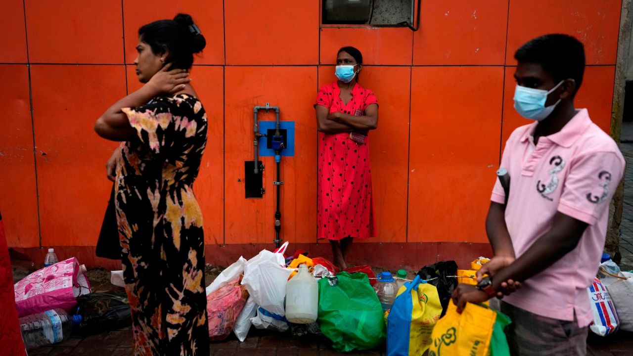 People line up at a fuel station hoping to buy kerosene oil in Colombo, Sri Lanka. 