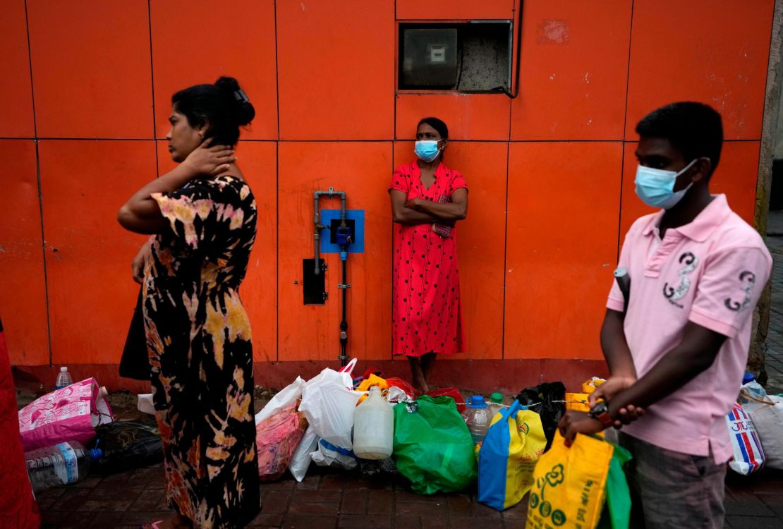 People line up at a fuel station hoping to buy kerosene oil in Colombo, Sri Lanka. 