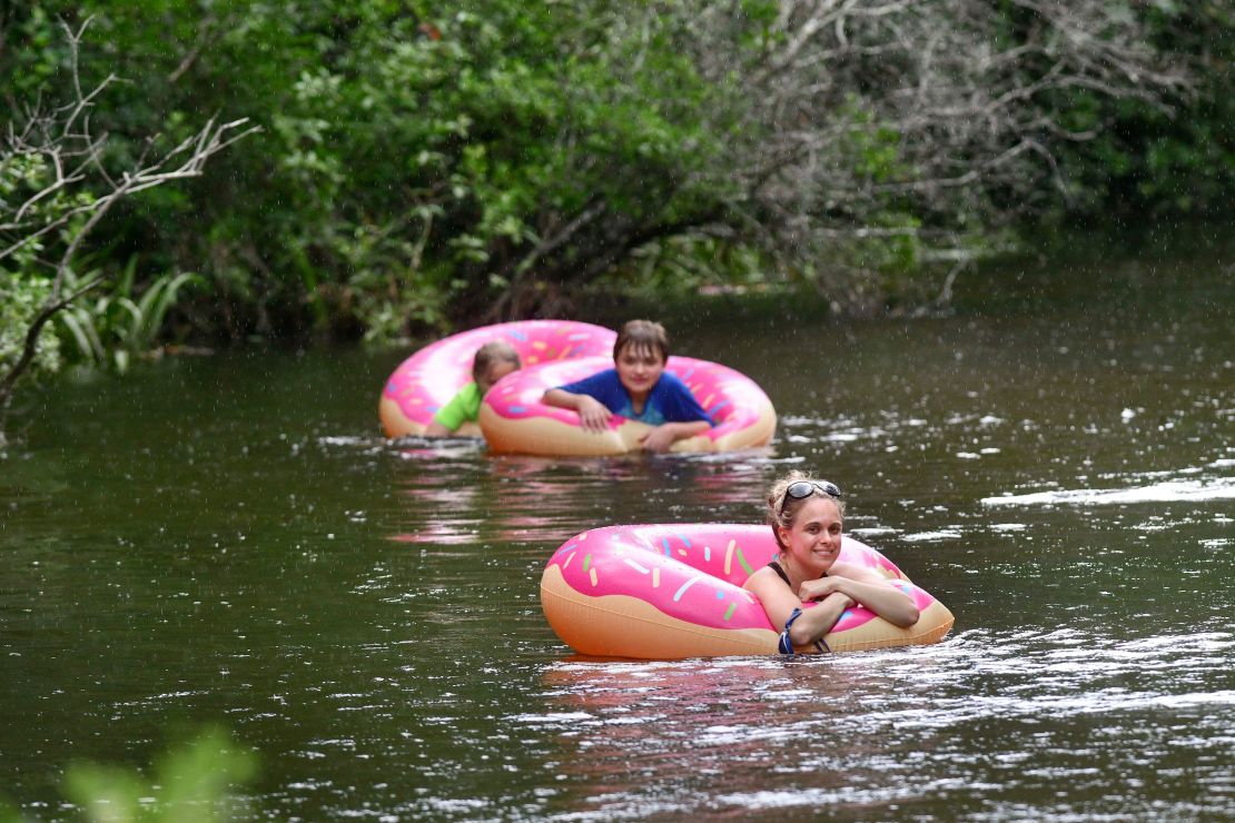 Liz Havard, Philip Smith and Miles Havard cool off Monday as they float down Turkey Creek in Niceville, Florida. The National Weather Service in Mobile issued a heat advisory for Monday and Tuesday, with heat index temperatures topping 100 degrees along the Florida panhandle. 