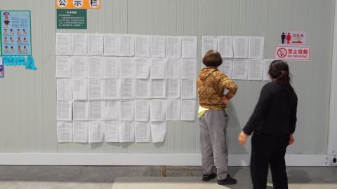 Covid test results are posted on the wall in the "lucky clover" quarantine site. 