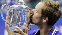 FILE - Daniil Medvedev, of Russia, kisses the championship trophy after defeating Novak Djokovic, of Serbia, in the men's singles final of the U.S. Open tennis championships, Sunday, Sept. 12, 2021, in New York. The U.S. Open tennis tournament will allow players from Russia and Belarus to compete this year despite the ongoing invasion of Ukraine that prompted a ban at Wimbledon.(AP Photo/John Minchillo, File)