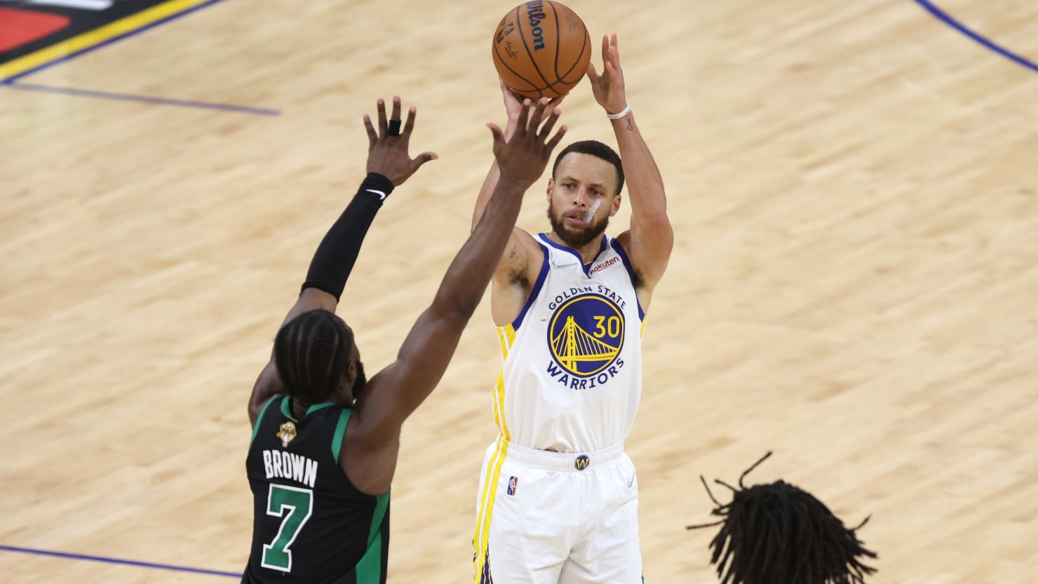 Steph Curry shoots a three pointer against Jaylen Brown of the Boston Celtics during the third quarter of Game 5 of the 2022 NBA Finals.