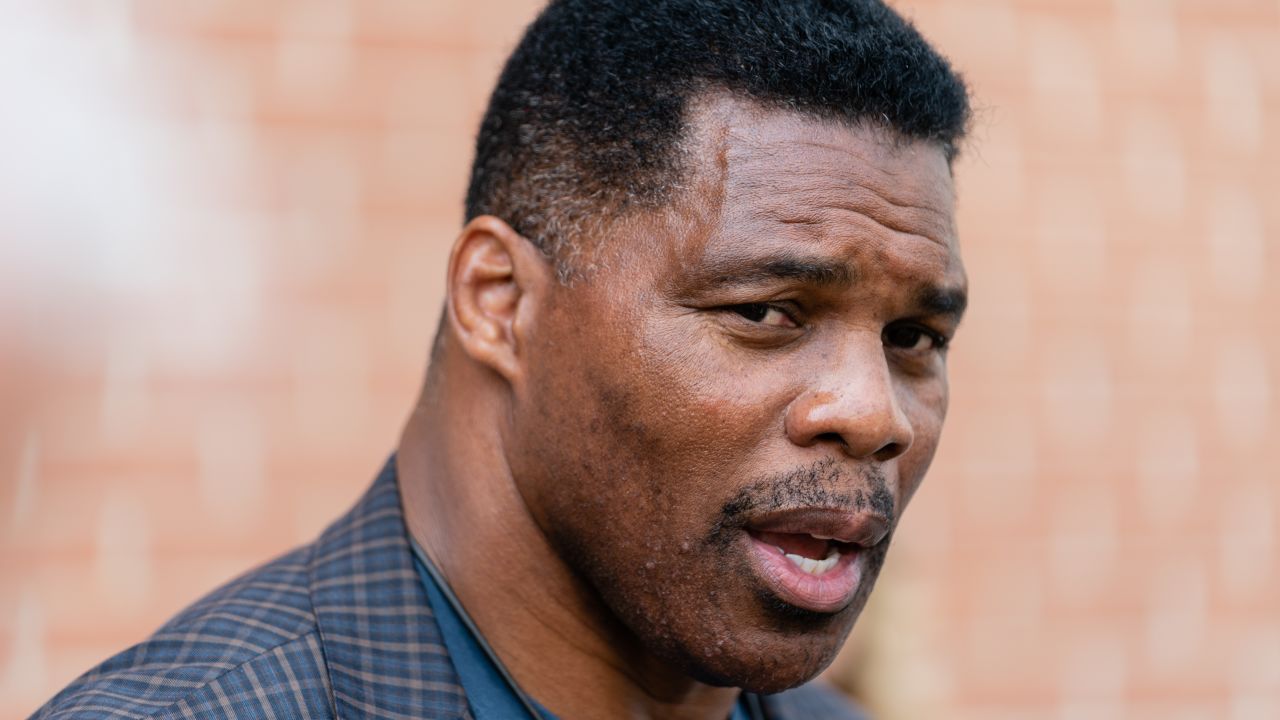 Republican Senate candidate Herschel Walker speaks to members of the media following a campaign rally in Macon, Georgia, on May 18, 2022.