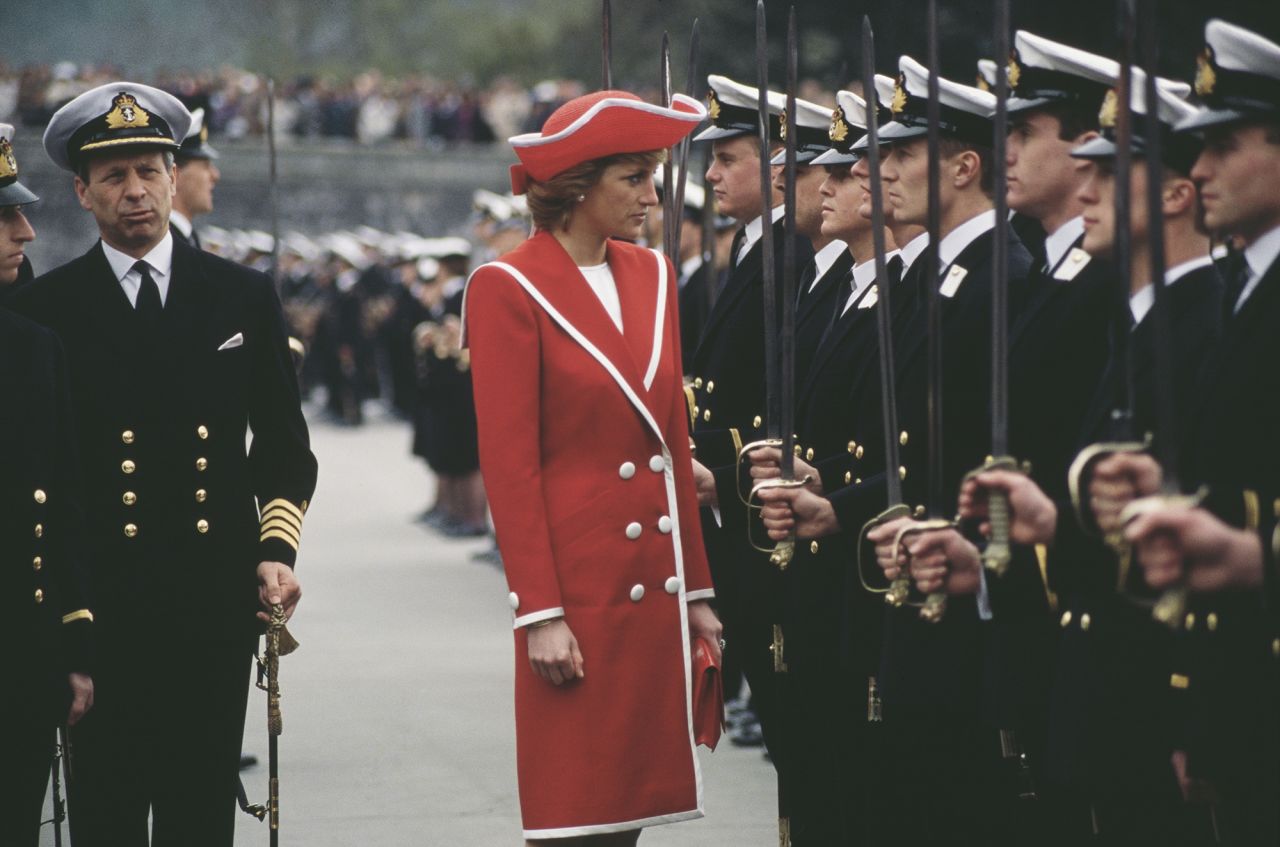 Diana, Princess of Wales attends the Royal Naval College in April 1989 wearing a Catherine Walker dress and a hat by Philip Somerville. 
