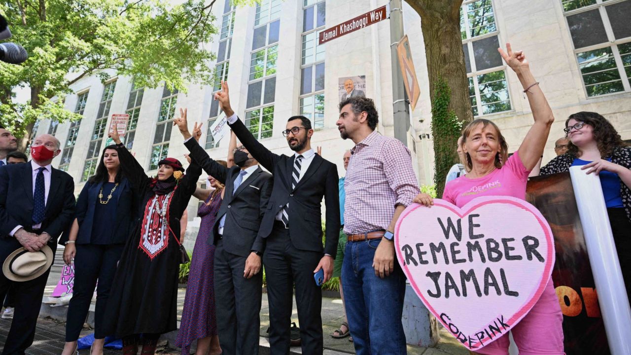 A street sign for "Jamal Khashoggi Way" is unveiled during a ceremony outside of the Embassy of Saudi Arabia in Washington, DC, on June 15, 2022.