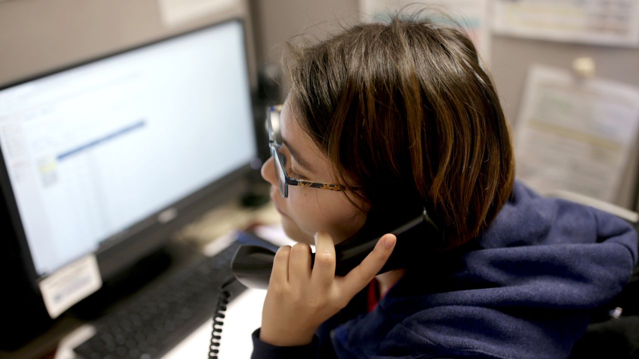 A volunteer at the Samaritans Call Center takes a call at the office in Boston on February 28, 2020.