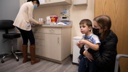 Ilana Diener holds her 3-year-old son during an appointment for a Moderna Covid-19 vaccine trial on Nov. 30, 2021. The US FDA gave emergency use authorization for the Moderna and Pfizer/BioNTech Covid-19 vaccines to include children as young as 6 months.