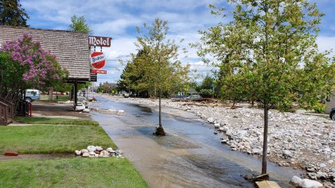 Photos taken on Tuesday afternoon show the aftermath of the flooding in Red Lodge, Montana. Images show the street covered in rocks and debris from the high water levels.