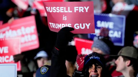 A supporter holds a sign heralding South Carolina state Rep. Russell Fry during a March rally with former President Donald Trump.