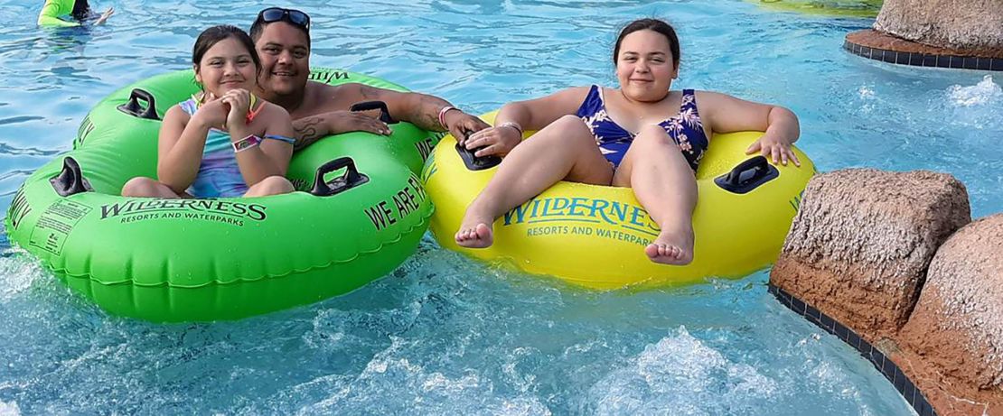 Aurora Dominguez, left, and her sister Laila loved going to the park and riding bikes with their dad, Benny. Now, Laila has to juggle grief and more responsibilities after the loss of her father.