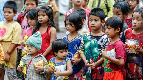 Children stand in a refugee camp along the Thai-Myanmar border.