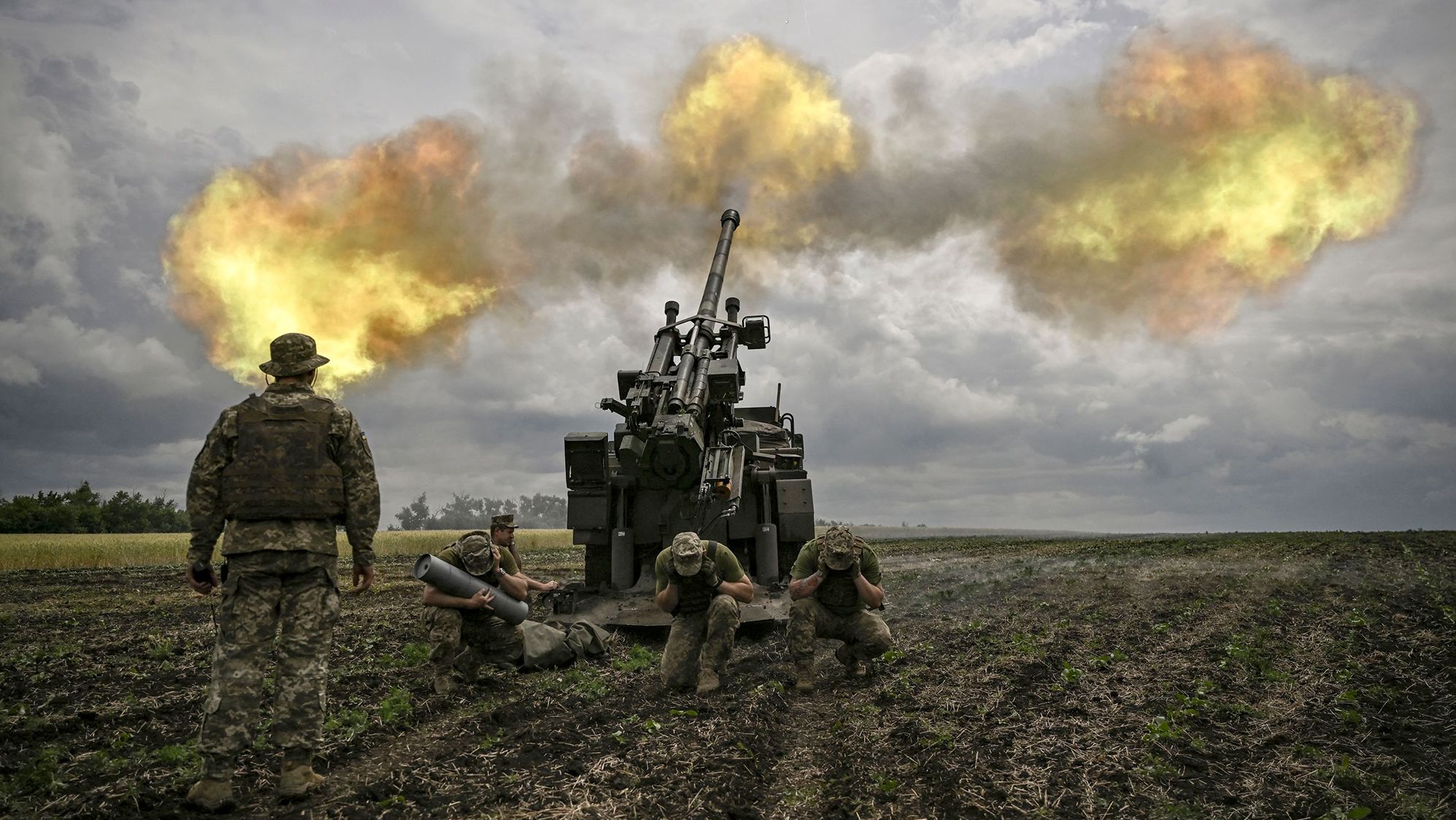 Ukrainian servicemen fire a French 155mm CAESAR self-propelled howitzer towards Russian positions in the eastern Ukrainian region of Donbas on June 15.