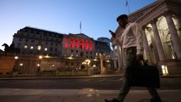 An evening commuter passes the Bank of England (BOE) in the City of London, UK, on Wednesday, June 15, 2022. 