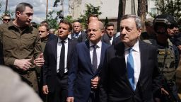 16 June 2022, Ukraine, Irpin: Oleksiy Chernyshov (l-r), Ukrainian President Selensky's special envoy for an EU accession perspective, walks with Emmanuel Macron, President of France, German Chancellor Olaf Scholz (SPD) and Mario Draghi, Prime Minister of Italy, past destroyed buildings in Irpin, Greater Kiev. German Chancellor Scholz, French President Macron and Italian Prime Minister Draghi arrived in the Ukrainian capital Kiev on Thursday morning. There they want to talk with Ukrainian President Selenskyj about further support for the country under attack from Russia. Photo: Kay Nietfeld/dpa (Photo by Kay Nietfeld/picture alliance via Getty Images)