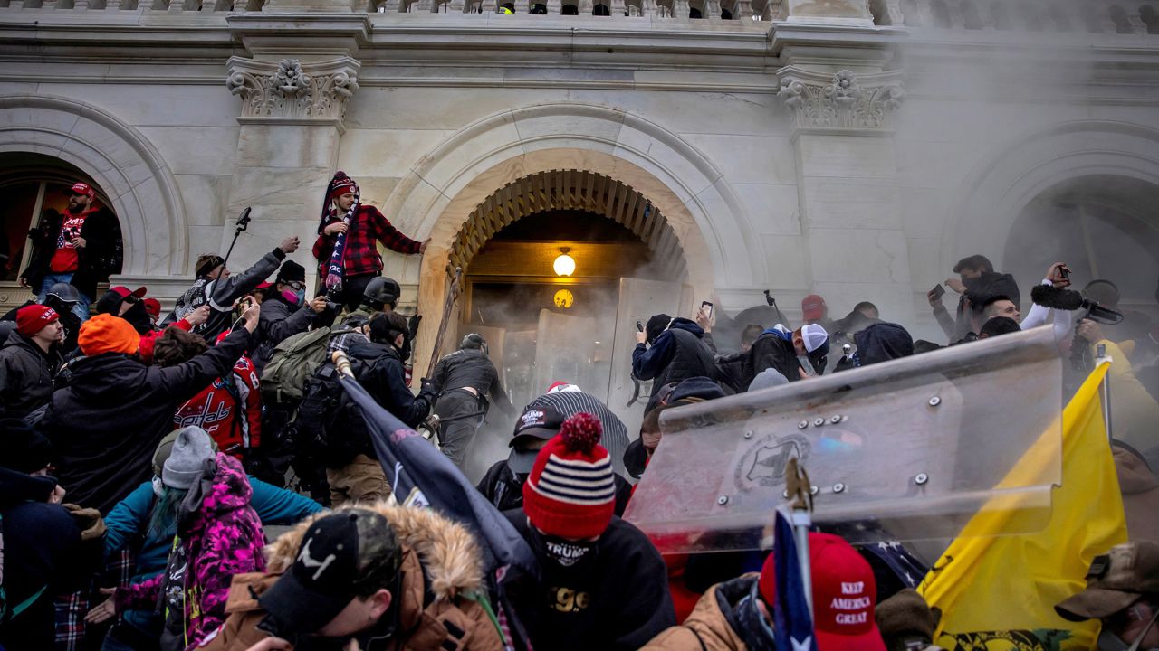 Trump supporters clash with police and security forces as people try to storm the US Capitol on January 6, 2021 in Washington, DC.