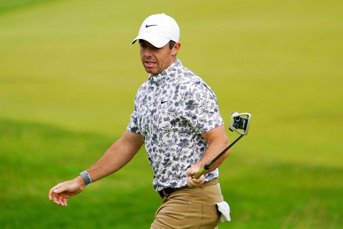McIlroy reacts to his putt on the 12th hole.