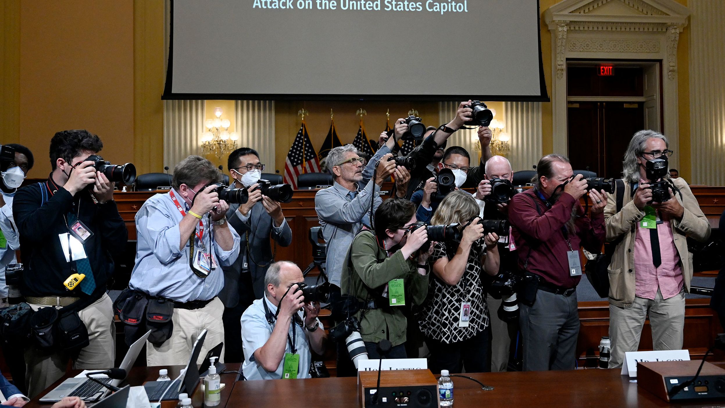 Photojournalists gather at the start of the hearing on June 16.
