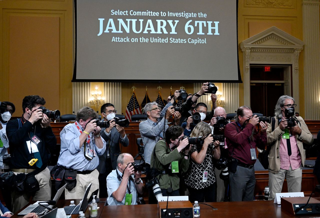 Photojournalists gather at the start of the hearing on June 16.