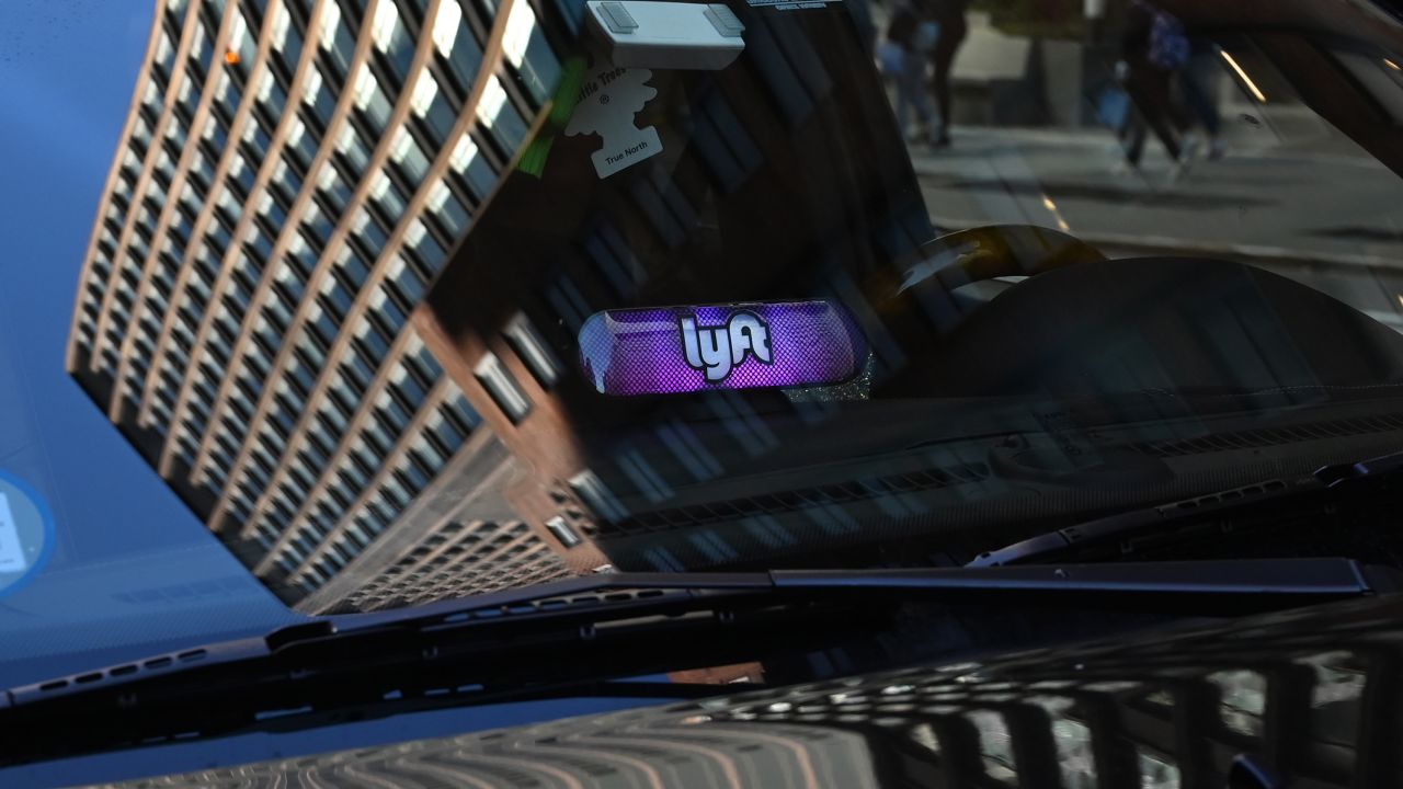 A Lyft ride-sharing car is seen on 42nd Street in New York on March 26, 2019. - Lyft Inc.'s initial public offering is expected to have its (IPO) this week making it the first of the ride-hailing companies to open up to the public.