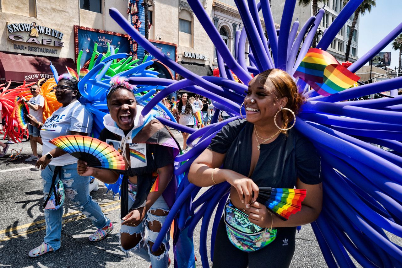 People take part in the LA Pride Parade on Sunday, June 12. The parade was making its return after a two-year hiatus due to Covid-19.