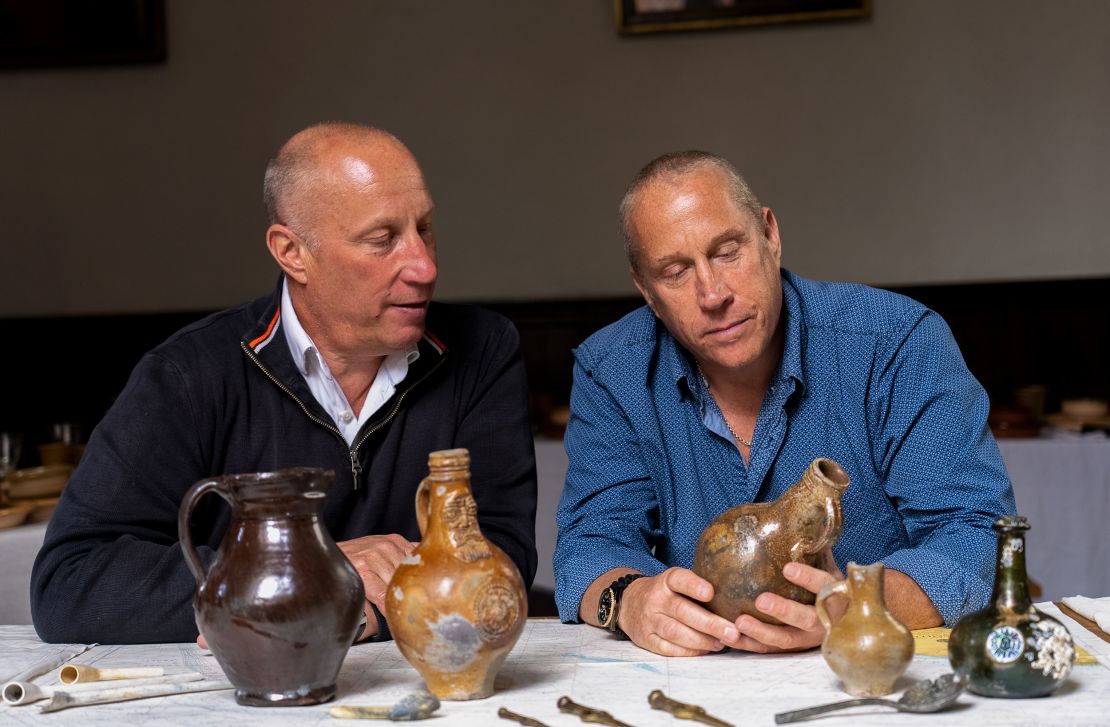 Julian (left) and Lincoln Barnwell show off some of their discoveries from the shipwreck.