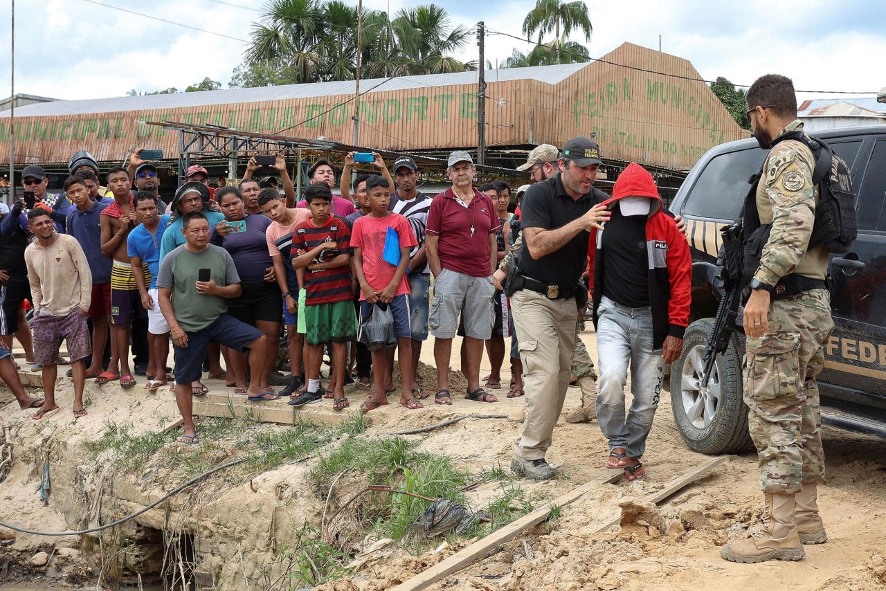 Federal police officers in Atalaia do Norte, Brazil, escort a man Wednesday, June 15, who was accused of being involved in the disappearance of British journalist Dom Phillips and indigenous expert Bruno Pereira, who went missing while reporting in a remote part of the Amazon rainforest near the border with Peru. <a href="https://www.cnn.com/2022/06/15/americas/apology-brazilian-ambassador-intl-gbr/index.html" target="_blank">Two people have been arrested</a> in connection with the case.