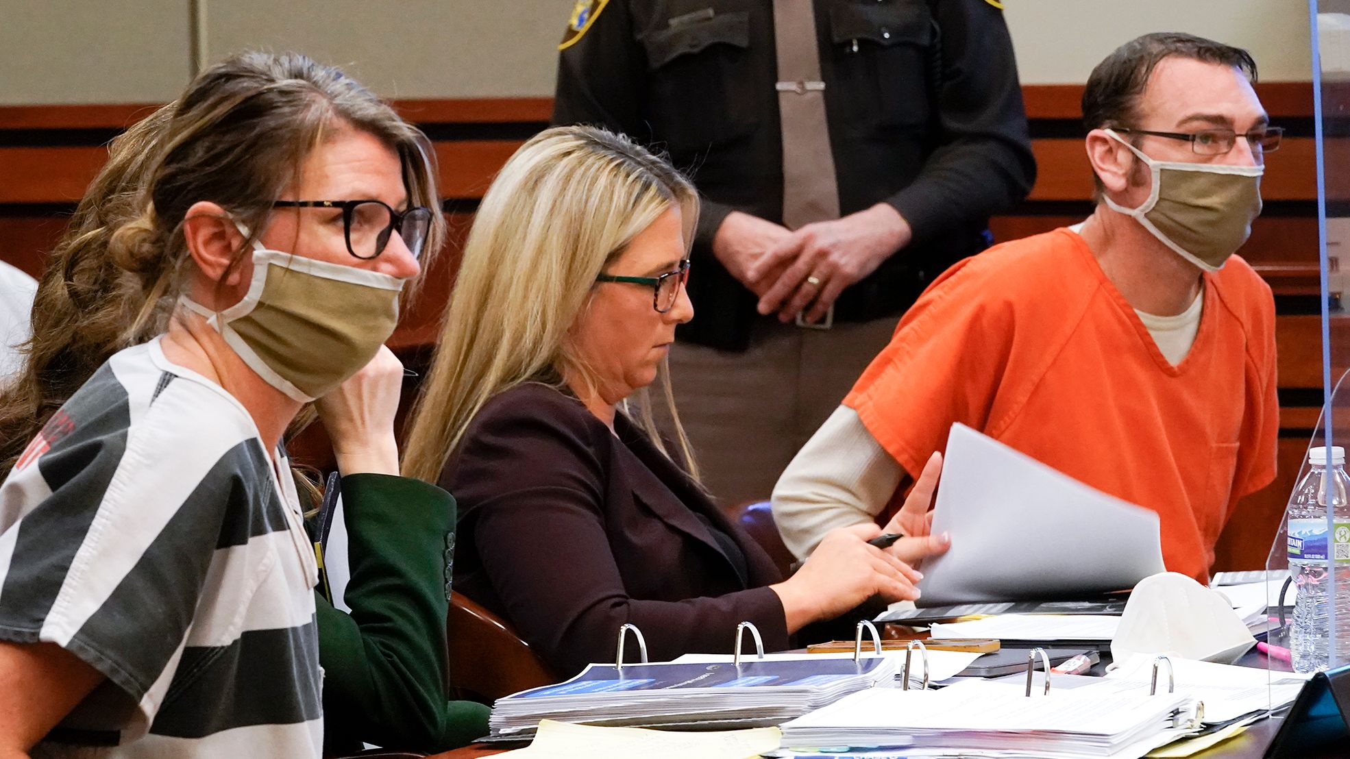 Jennifer Crumbley, left, and James Crumbley, right, appear in court for a preliminary examination on involuntary manslaughter charges in Rochester Hills, Michigan, on February 8, 2022.
