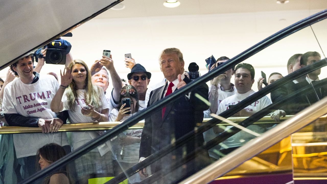 In this June 16, 2015, file photo, Donald Trump rides an escalator to a press event to announce his candidacy for the presidency at Trump Tower on in New York City.