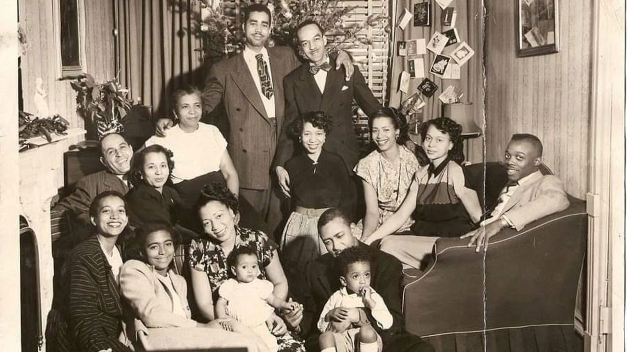 The writer's great-aunt (bottom row, third from  left) celebrates Christmas with family in Brooklyn in 1949. She died of liver failure 10 years later at age 49.