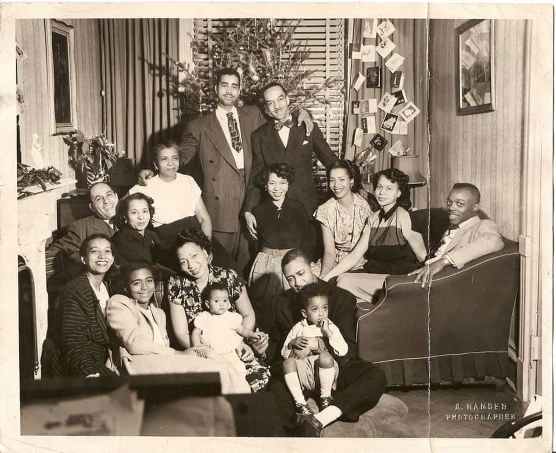 The writer's great-aunt (bottom row, third from  left) celebrates Christmas with family in Brooklyn in 1949. She died of liver failure 10 years later at age 49.