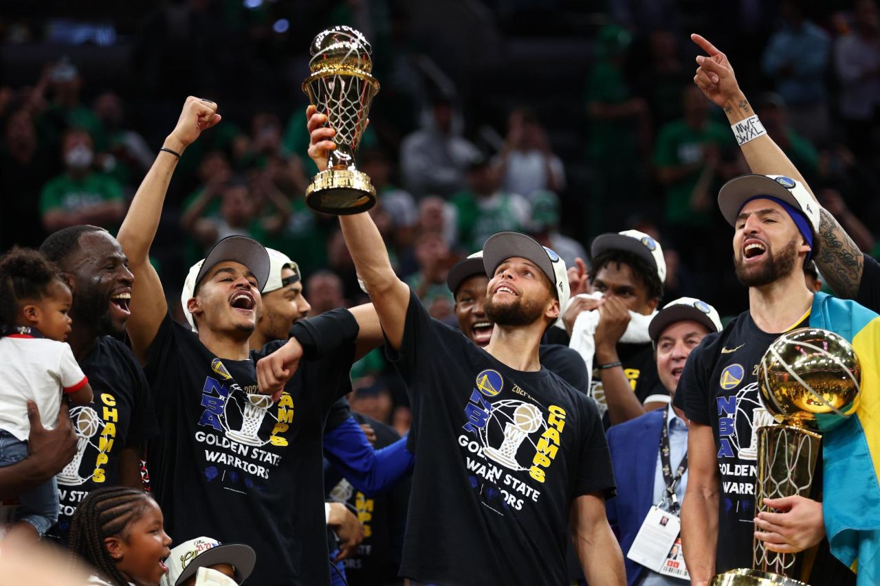 Stephen Curry raises the Bill Russell NBA Finals Most Valuable Player Award after <a href="http://www.cnn.com/2022/06/16/sport/nba-finals-2022-warriors-celtics-game-6/index.html" target="_blank">the Golden State Warriors won their fourth title in eight years</a> on Thursday, June 16. The Warriors defeated the Boston Celtics in six games.
