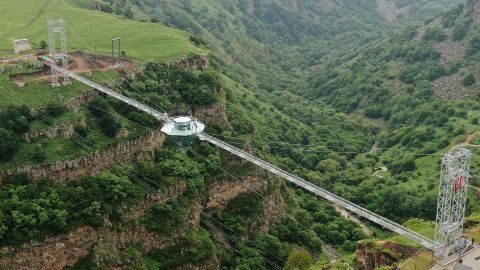 The transparent bridge stretches across the canyon, providing stunning views of the natural monument.