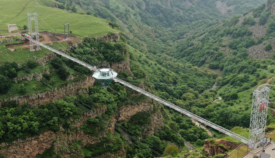 The transparent bridge stretches across the canyon, providing stunning views of the natural monument.