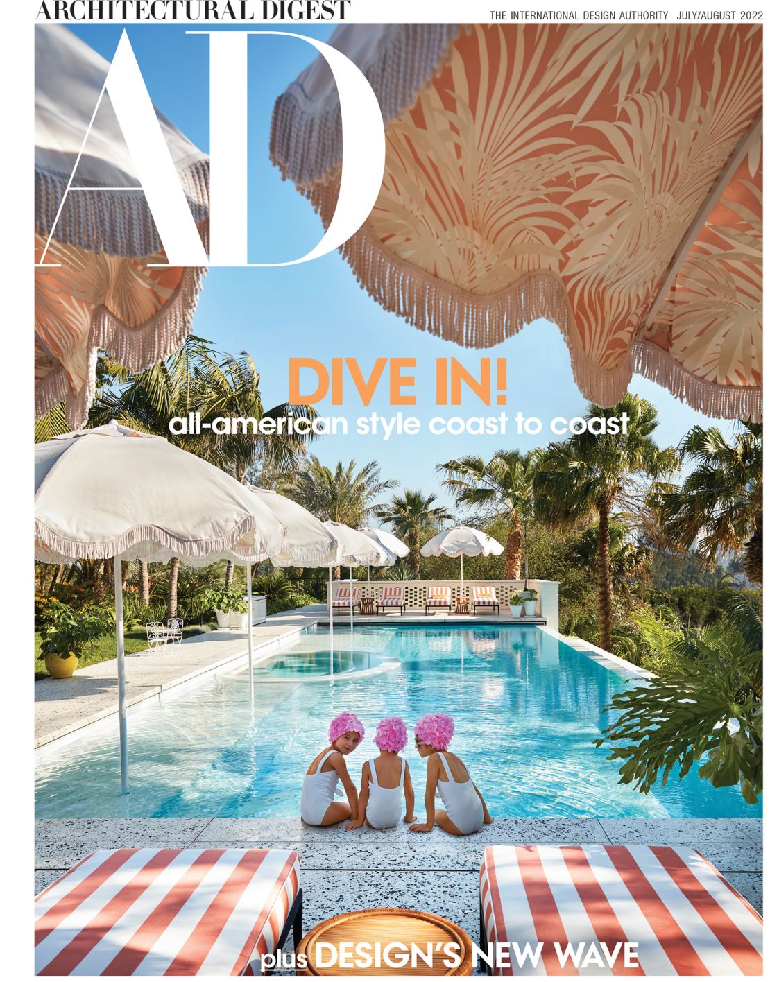 Mary Kitchen's three daughters photographed sitting by the pool on the front cover of Architectural Digest's July/ August issue.