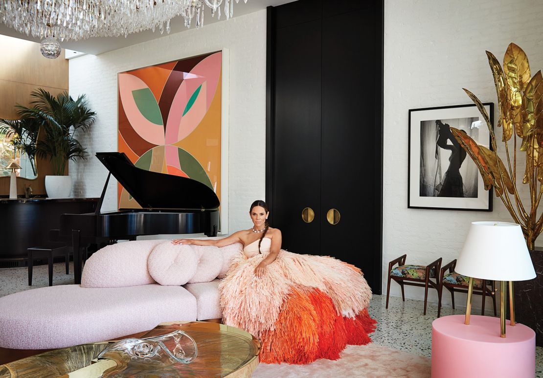 Mary Kitchen, wearing an Oscar de la Renta gown, sits in her living room.