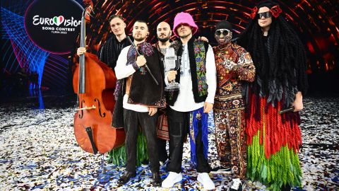 Members of the band Kalush Orchestra pose onstage after winning the Eurovision Song Contest 2022 on May 14.