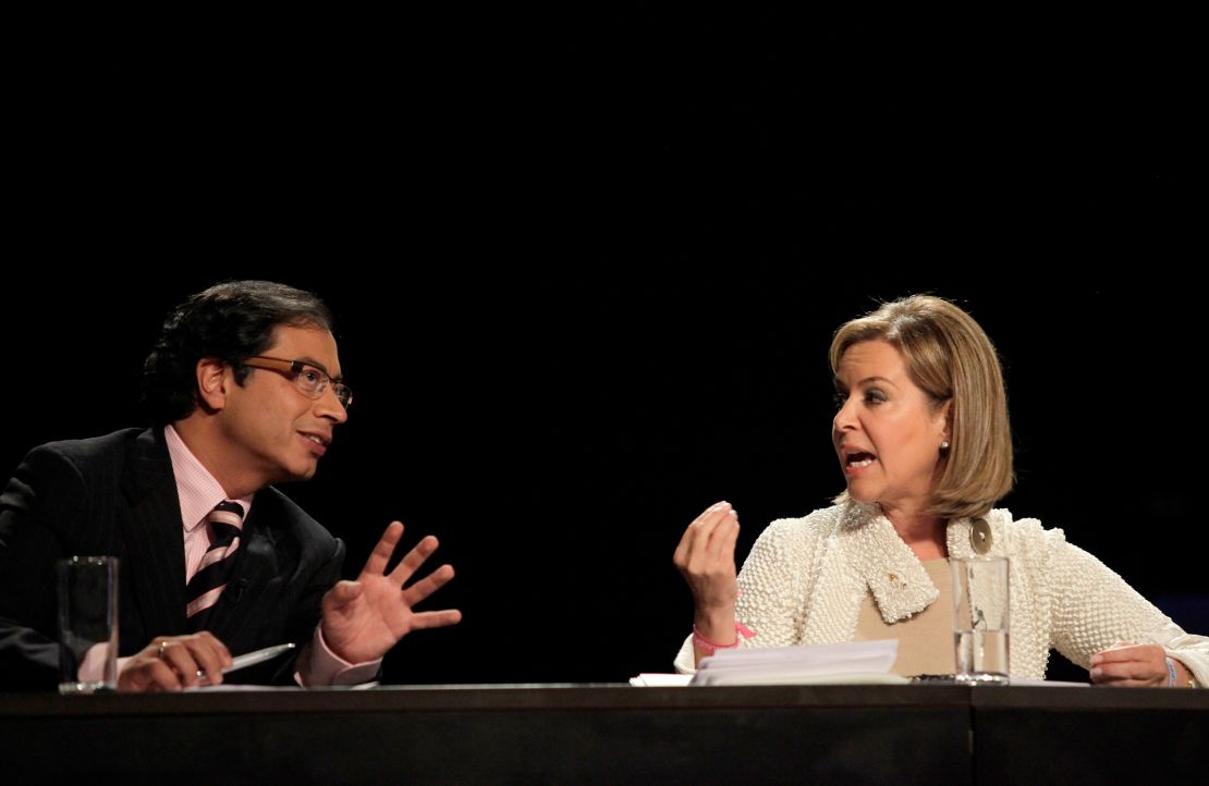 Petro, left, and Noemi Sanin, of the Conservative Party, gesture as they take part in a televized presidential debate in Bogota in May 2010. 