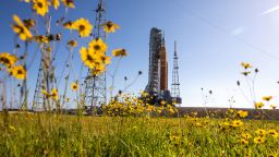 With wildflowers surrounding the view, NASA's Artemis I Moon rocket -- carried atop the crawler-transporter 2 -- arrives at Launch Pad 39B at the agency's Kennedy Space Center in Florida on June 6, 2022. The rocket rolled out of the Vehicle Assembly Building in the early morning hours to travel the 4.2 miles to the launch pad for NASA's next wet dress rehearsal attempt ahead of the Artemis I launch. The first in an increasingly complex series of missions, Artemis I will test the Space Launch System rocket and Orion spacecraft as an integrated system prior to crewed flights to the Moon. Through Artemis, NASA will land the first woman and first person of color on the lunar surface, paving the way for a long-term lunar presence and using the Moon as a steppingstone before venturing to Mars. 