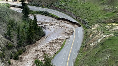 A June 13, 2022, aerial photo provided by the National Park Service shows a washed-out road at Yellowstone National Park in Gardiner, Montana.