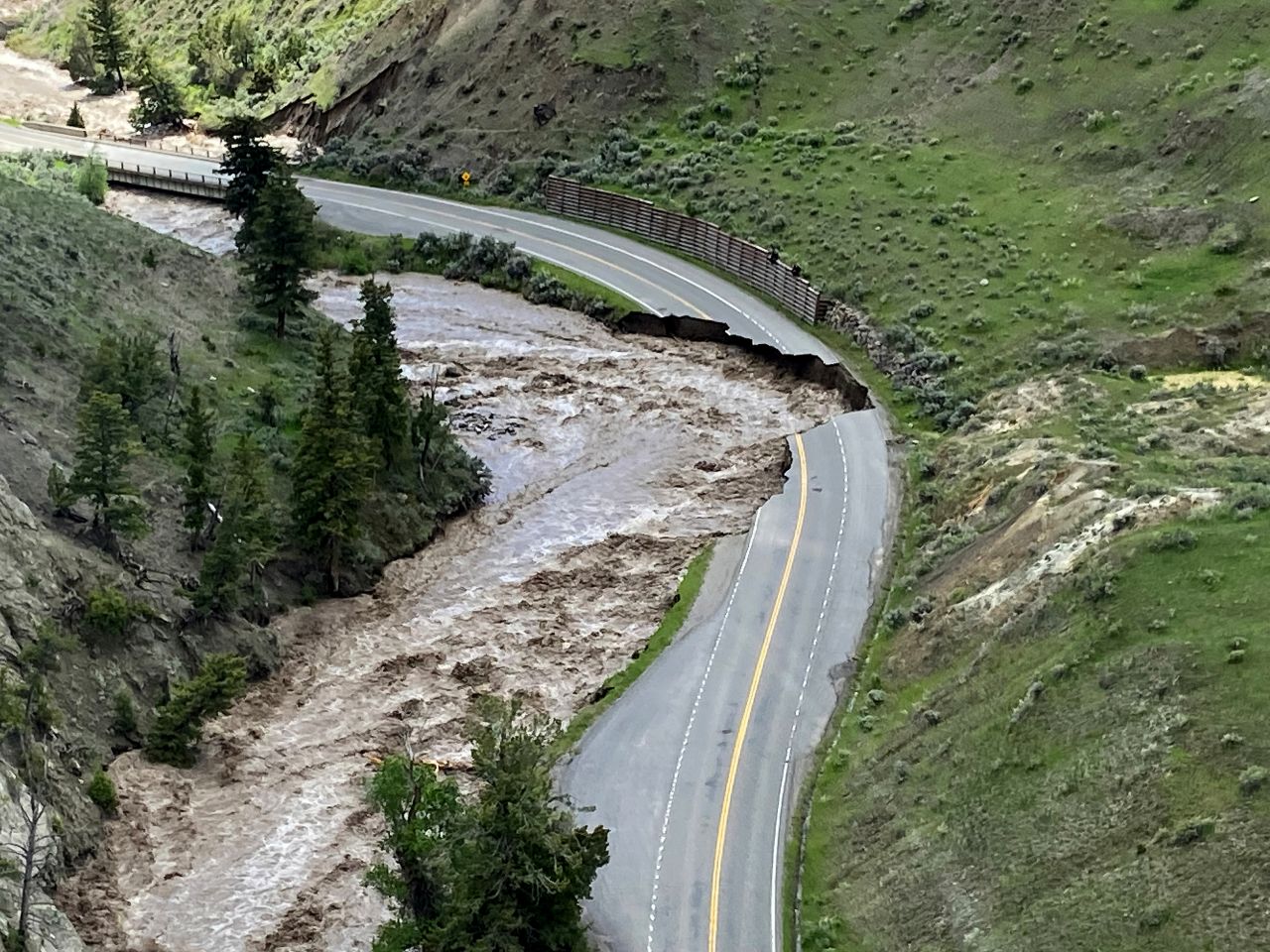 A road is damaged inside Yellowstone National Park in Gardiner, Montana, on Monday.