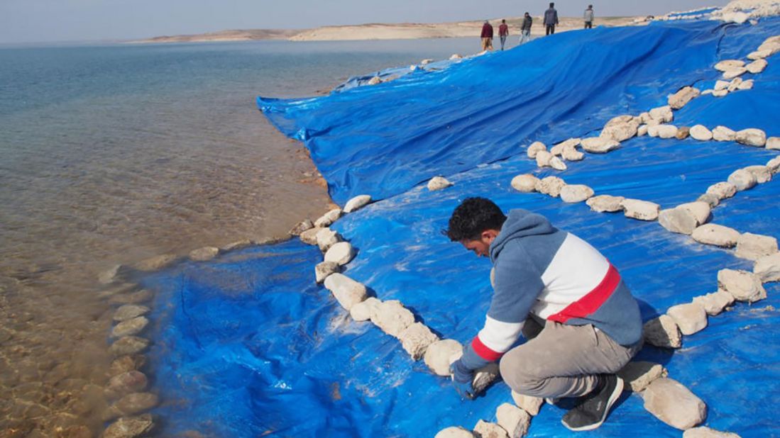 Researchers tightly covered the ruins with plastic tarps to prevent the ancient site from water erosion. 