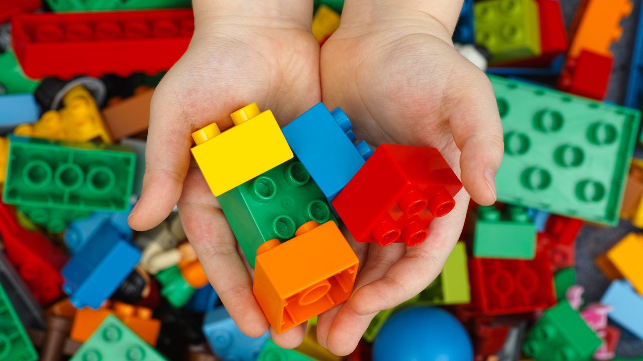 Lego Duplo Bricks in child's hands.