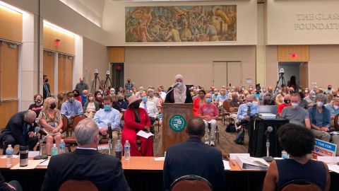 FILE - In this Aug. 23, 2021 file photo, Areeqe Hammad, of Cleveland, testifies at the first public hearing of the Ohio Redistricting Commission at Cleveland State University in Cleveland.  A new voter-approved commission in Ohio that was supposed to reduce partisanship in the once-a-decade process of political map-drawing has already become a flop.  Similar commissions meeting for the first time in New York and Virginia have devolved into partisan finger-pointing, undermining their intent. (AP Photo/Julie Carr Smyth, File)