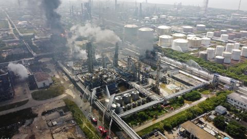 Fire engines and rescue workers at the scene of the fire in Shanghai on Saturday.
