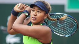 Naomi Osaka of Japan in action against Amanda Anisimova of the United States on Court Suzanne Lenglen during the singles first round match at the 2022 French Open Tennis Tournament at Roland Garros on May 23rd 2022 in Paris, France.
