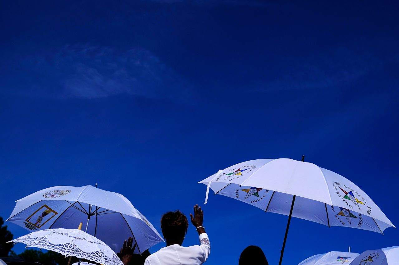 A person waves during a Juneteenth parade in East Point, Georgia, on Saturday.