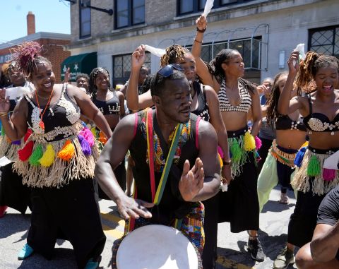 A drummer and dancers perform in Columbus, Ohio, on Saturday.