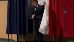 France's President Emmanuel Macron leaves the voting booth as he votes in the second stage of French parliamentary elections at a polling station in Le Touquet, northern France on June 19, 2022. (Photo by Michel Spingler / POOL / AFP) (Photo by MICHEL SPINGLER/POOL/AFP via Getty Images)